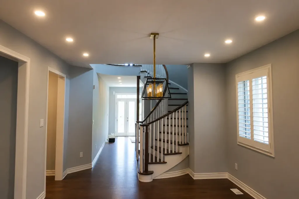 Modern hallway recessed lighting layout with evenly spaced pot lights